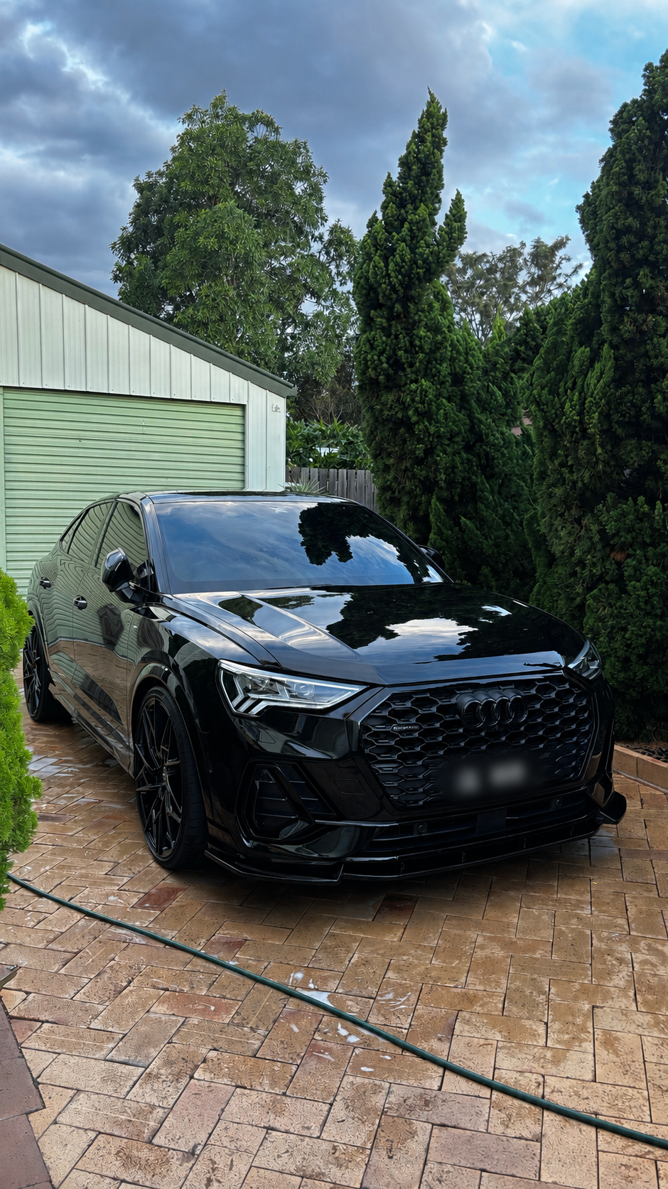 Glossy luxury car detailed under cinematic light